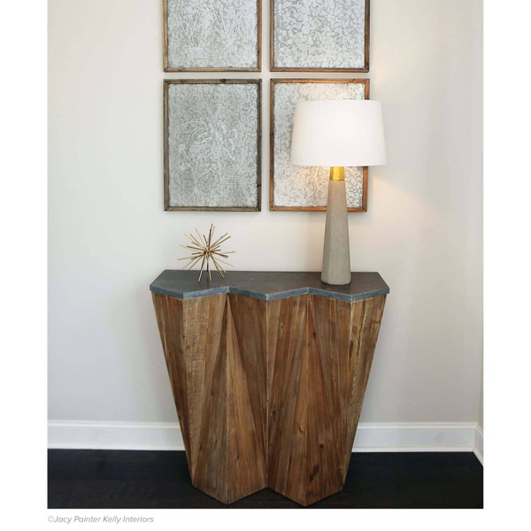 Hallway table with a concrete table lamp and metal sculpture